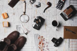 Holiday planning with map, camera, and tickets