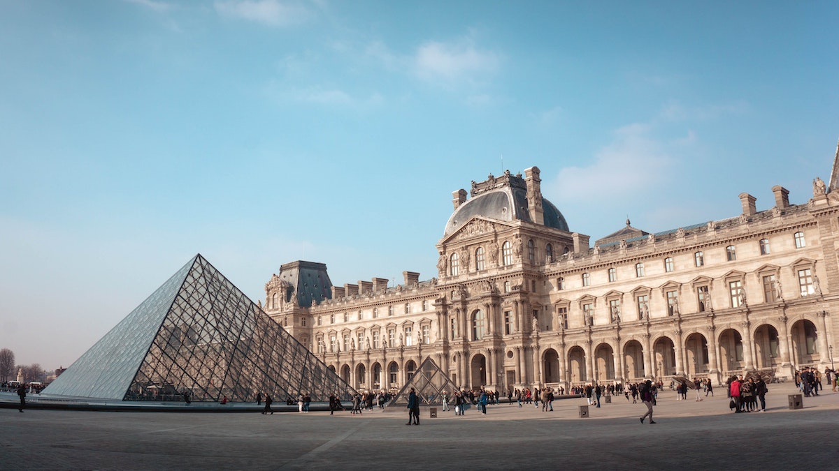View of the Louvre façade and pyramid.